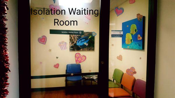 Here we have our isolation room where moms can feel comfortable waiting a short time with their sick child in this second waiting room.