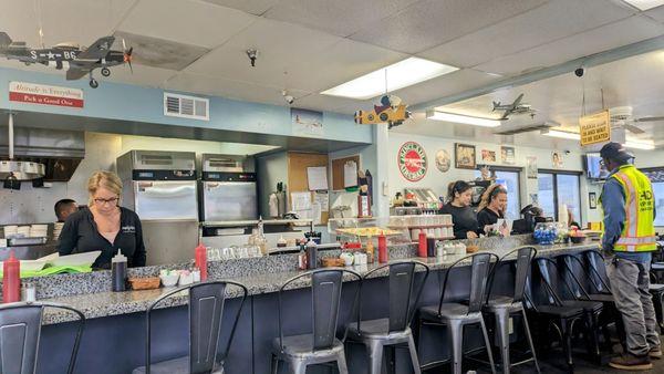 Open kitchen with bar seating