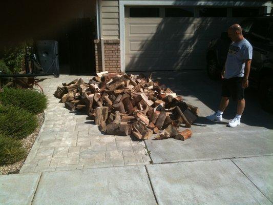 Another happy customer inspecting a 1/2 Cord Mixed Firewood delivery in Vacaville, CA