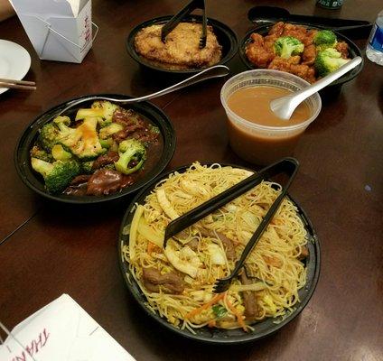 Beef and broccoli, shrimp egg foo young with gravy on the side, orange chicken, and Singapore rice noodles