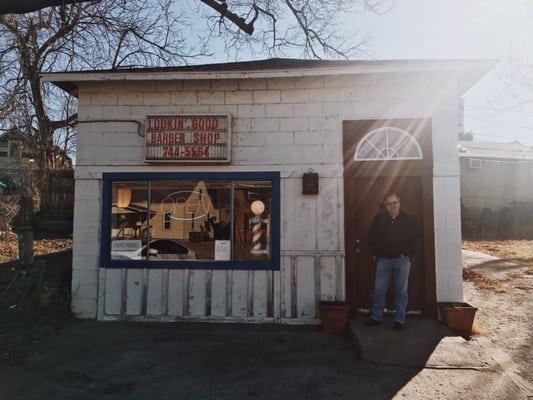 My dad outside the shop after his haircut.