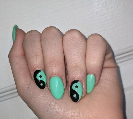 Green and black nail design done at Lisle Nail lounge