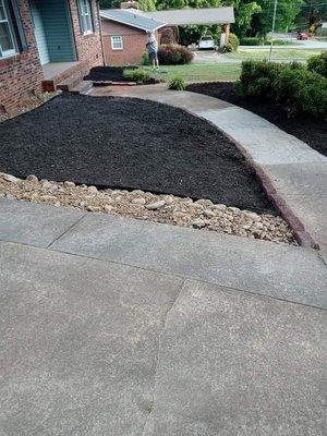 Walkway, river rock, and black mulch job.