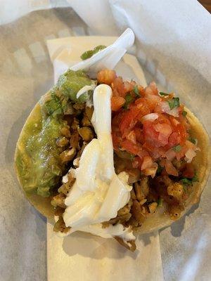 Taco - chicken, cheese, avocado, beans, sour cream and pico de Gallo. So juicy and flavorful