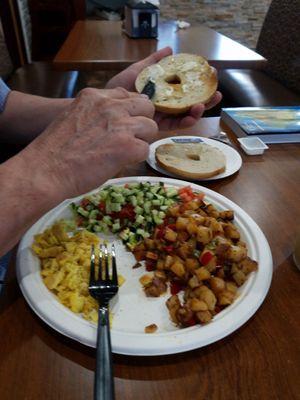 Imperial Breakfast.  Eggs, potatoes,  Israeli salad, and bagel.