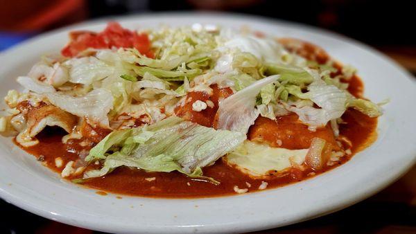 Enchiladas supreme.. 4 enchiladas (beef, chicken, beans, cheese) topped with cheese, lettuce and sour cream