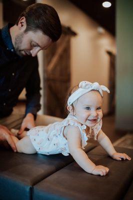 Dr. Ryan adjusting his daughter, Faith.