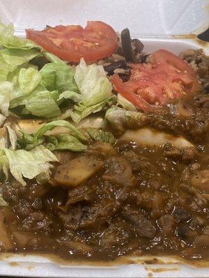 Oxtails served over rice and peas.