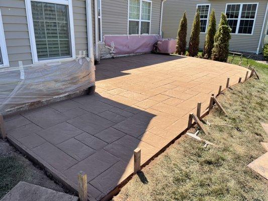 Stamped concrete patio before power wash