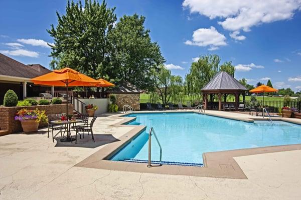 Swimming pool with terraced deck and gourmet outdoor kitchen