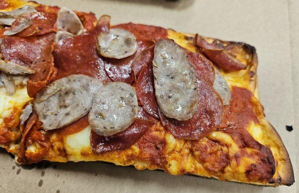 Sicilian slice with sausage and pepperoni