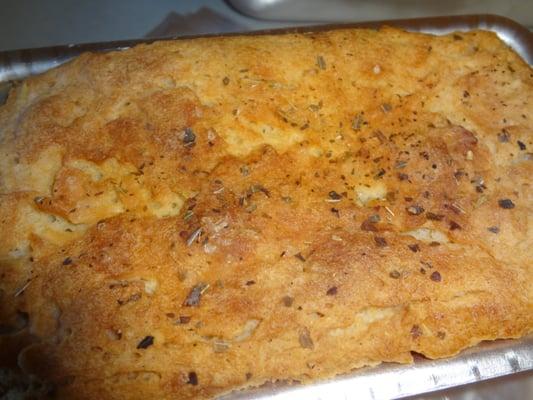 Our Rosemary Focaccia Bread- a savory blend of rosemary, oregano and basil. Perfect for any meal.