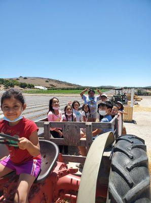 Class photo on a tractor