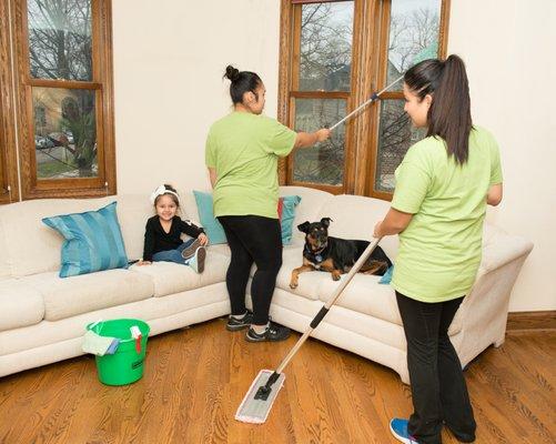 Two Fresh Tech Maid technicians cleaning a home.