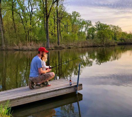 Father and daughter fishing on one of our two lakes