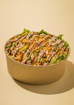 Romaine lettuce, grilled chicken, corn, red onion, tortilla strips, shredded cheddar, with lite ranch & tangy BBQ sauce