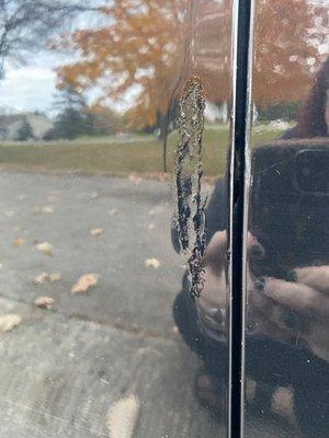 The rust/scratch damage on my door they "repaired" by simply painting over instead of sanding, making even, filling, then repainting.