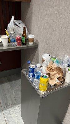 Trash and flies in the "prestigious" M Lounge.