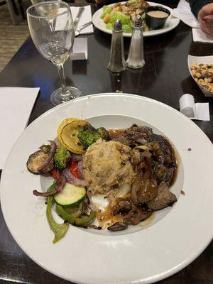 Steak tips with mashed potatoes and side veggies