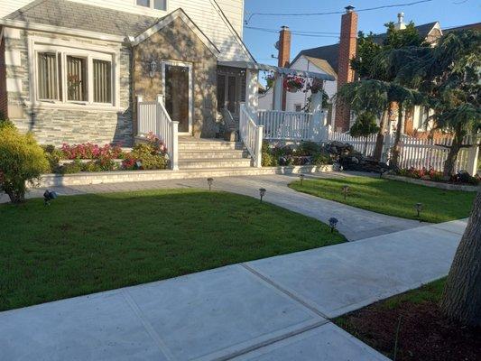 New sidewalk ,granite stoop ,granite flower boxes ,granite porch ,granite walk .Stone face and stucco trim ,waterfall pond .