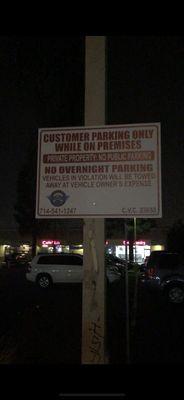 They are putting up illegal signs on shopping centers the do not manage and towing illegally