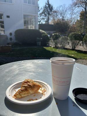 Croissant and tea at outdoor seating