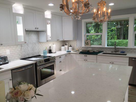 Kitchen lighting. We antiqued three chandeliers.