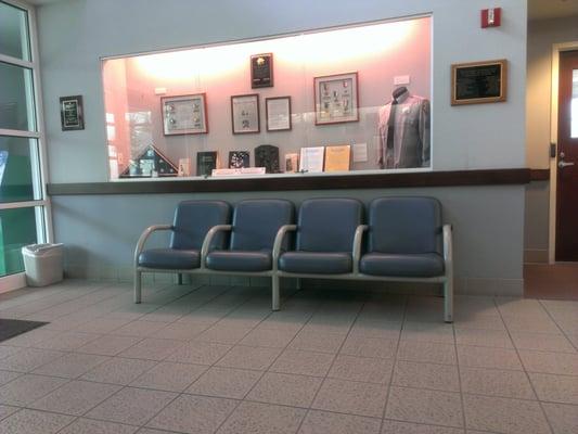 Lobby waiting area. There are 4 more seats across from these