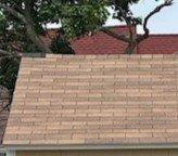 Missing shingle top let corner on roof ridge.