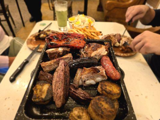 Parrillada:
Churrasco, 1/4 Chicken, 2 ribs, chorizo, morcilla, 1 Sweet corn, 1 roasted pepper and 2 sides