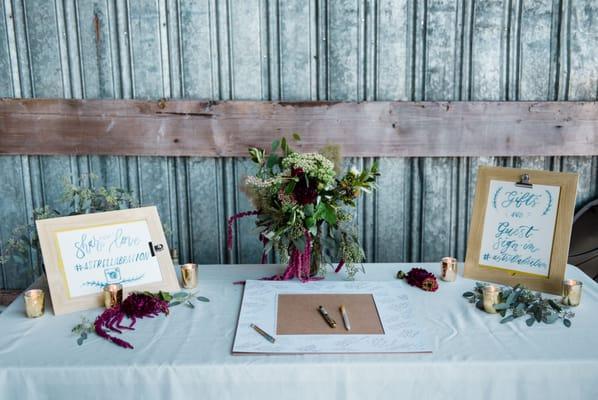 A few of the unique, lovely arrangements on our guestbook table. Photo Credit: Laura Morsman Photography