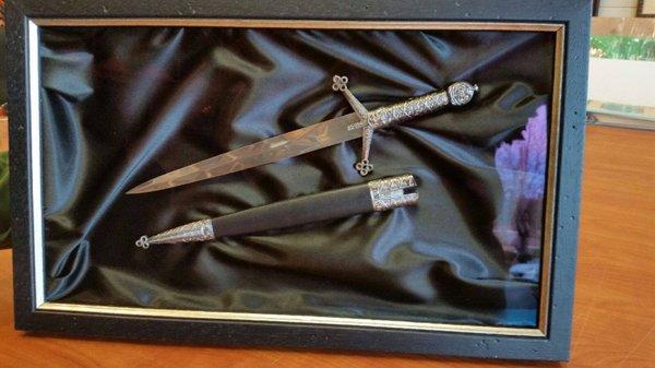 A stunning presentation of an antique sword from a French castle designed and executed by Karen Fox.