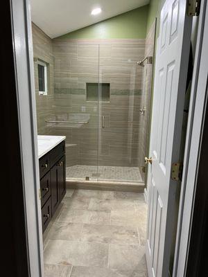 Love the floors, shower tile, and accent/niche tile from Mosaic