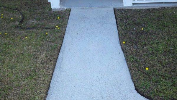 Concrete sidewalk surfaces after ALLCLEAN™ pressure washing.