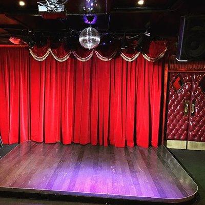 Intimate stage and plush red leather doors