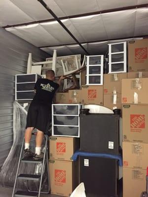 Casey packing it all in. Their packing skills saved me from having to get another storage unit.