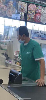 Cashier wearing mask incorrectly.