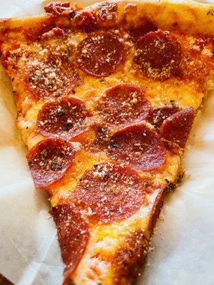 Slice of pepperoni pizza.