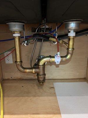 Remove the garbage disposal and replace with new piping