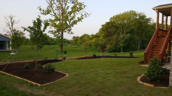 Sod installation, Grading, and added raised beds