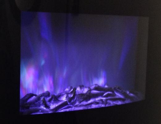 Electric fireplace in the massage room