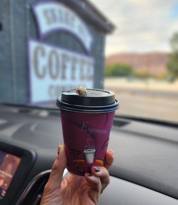 12 oz oat milk latte served with espresso bean