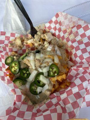 Poutine waffle fries with fresh jalapeño slices (or you can get pickled).