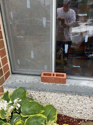 Brick on the window to stop rattling for three years