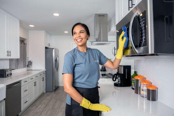 Cleaning the kitchen.