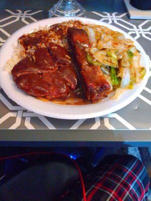 Ribs, hamburger, rice and gravy, fried cabbage.