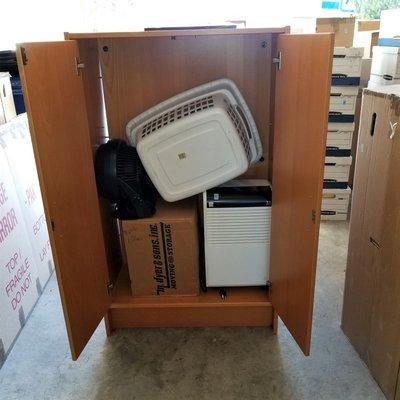 Overstuffed and broken office hutch