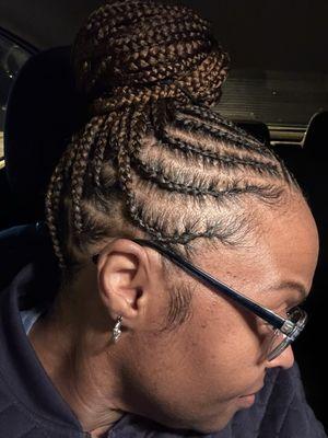 Medium Tribal Box Braids pinned up on top of head. Right side view. Styled by Trey at Trey-Von Salon.