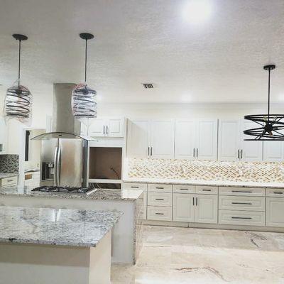 Full kitchen renovation in progress. Cre8tive installed the flooring, backsplash, cabinetry, Granite Countertops, lighting and fixtures.