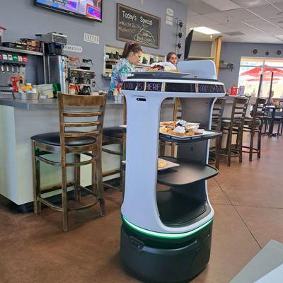 The robot serving to a table.